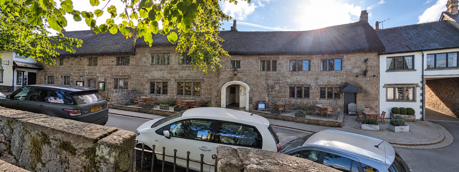 Historic granite facade of the Three Crowns inn in Chagford