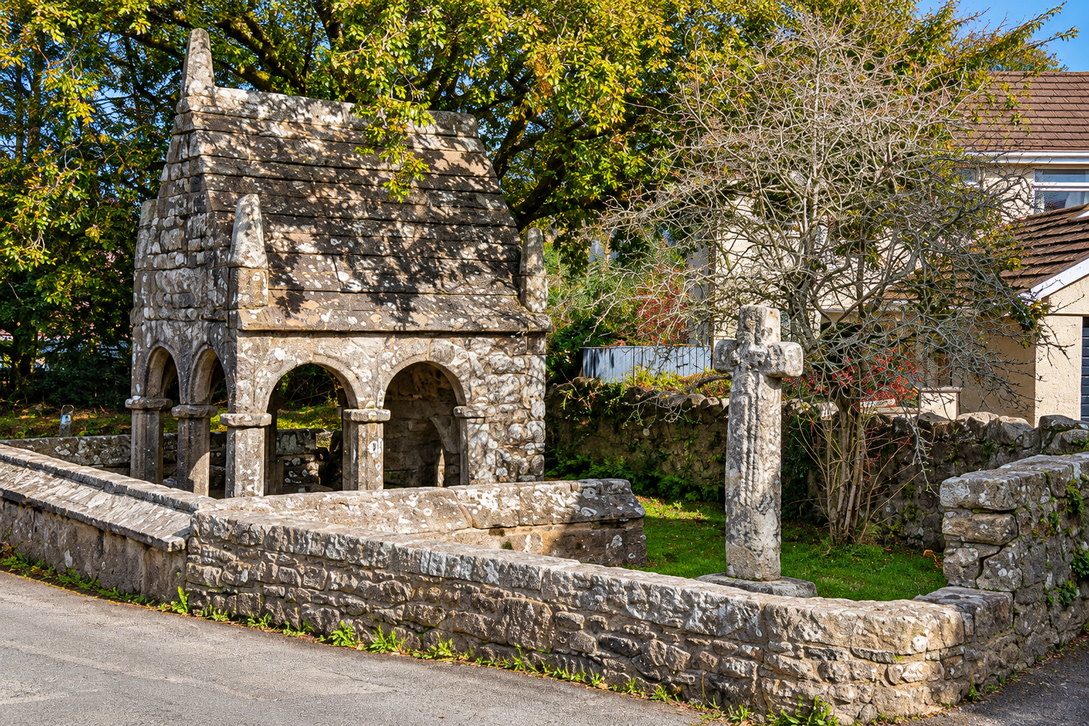 St Cleer Holy Well and the adjacent stone cross.