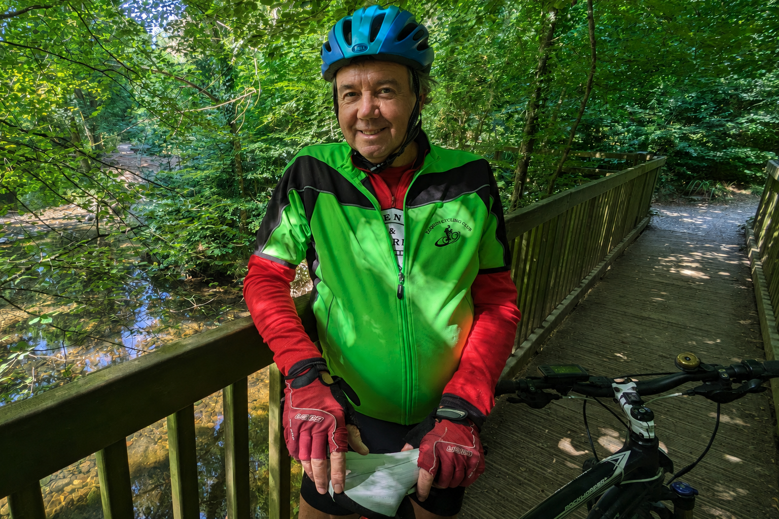 A Plymouth Cycling Club rider on a wooded footbridge.