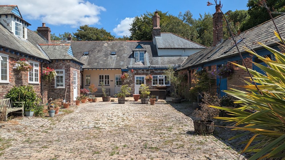 A further view of the courtyard and former estate buildings.